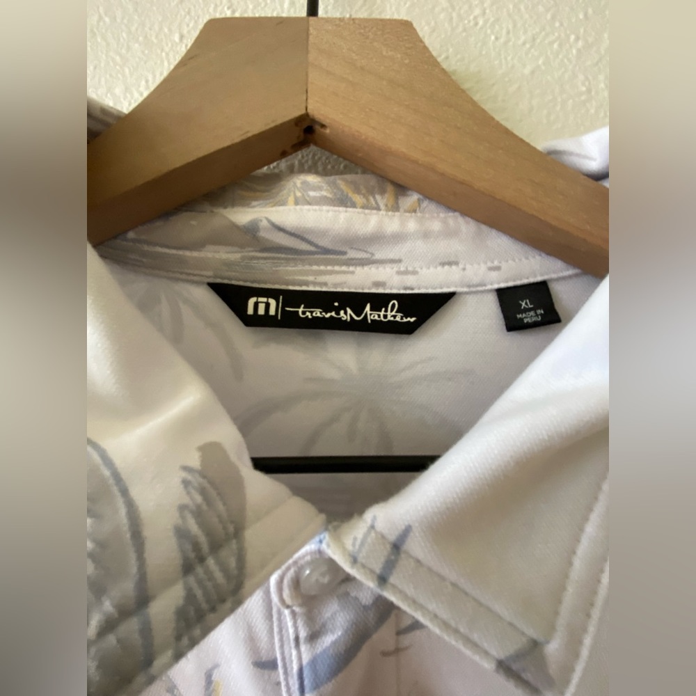 Travis Mathew’s golf shirt size XL
